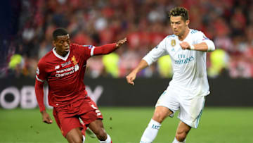 KIEV, UKRAINE - MAY 26: Cristiano Ronaldo of Real Madrid evades Georginio Wijnaldum of Liverpool during the UEFA Champions League Final between Real Madrid and Liverpool at NSC Olimpiyskiy Stadium on May 26, 2018 in Kiev, Ukraine. (Photo by Michael Regan/Getty Images)
