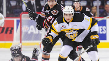 CALGARY, AB - OCTOBER 8: Jake Bean #2 of the Calgary Hitmen loses the puck to Braden Schneider #2 of the Brandon Wheat Kings during a WHL game at the Scotiabank Saddledome on October 8, 2017 in Calgary, Alberta, Canada. (Photo by Derek Leung/Getty Images)