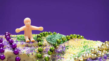 Nothing says Mardi Gras like a plastic baby stuffed inside a cake.