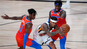 OKC Thunder Shai Gilgeous-Alexander, left, and Luguentz Dort, right, guard Utah Jazz's Jordan Clarkson: Ashley Landis/Pool Photo via USA TODAY Sports
