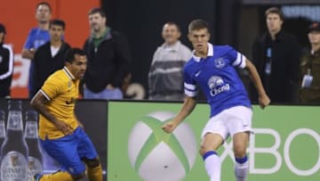 Jul 31, 2013; San Francisco, CA, USA; Everton defender John Stones (26) passes the ball back against Juventus forward Carlos Alberto Teves (10) at AT&T Park. Mandatory Credit: Kelley L Cox-USA TODAY Sports