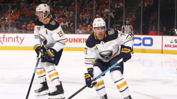 PHILADELPHIA, PA - DECEMBER 19: Jake McCabe #19 and Evan Rodrigues #71 of the Buffalo Sabres in action against the Philadelphia Flyers at the Wells Fargo Center on December 19, 2019 in Philadelphia, Pennsylvania. (Photo by Mitchell Leff/Getty Images)