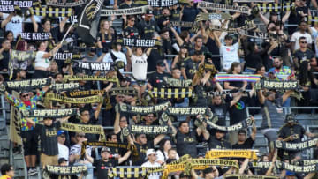 Jun 29, 2022; Los Angeles, California, USA; LAFC fans hold scarves during the game against FC Dallas at Banc of California Stadium. Mandatory Credit: Kirby Lee-USA TODAY Sports