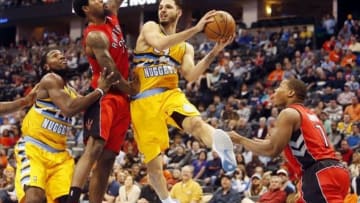 Jan 31, 2014; Denver, CO, USA; Denver Nuggets guard Evan Fournier (94) drives to the basket during the first half against the Toronto Raptors at Pepsi Center. Mandatory Credit: Chris Humphreys-USA TODAY Sports