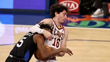 NEW YORK, NEW YORK - JANUARY 29: Cedi Osman #16 of the Cleveland Cavaliers fouls Immanuel Quickley #5 of the New York Knicks in the third quarter at Madison Square Garden on January 29, 2021 in New York City.NOTE TO USER: User expressly acknowledges and agrees that, by downloading and or using this photograph, User is consenting to the terms and conditions of the Getty Images License Agreement. (Photo by Elsa/Getty Images)