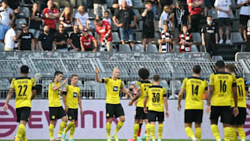 Borussia Dortmund players celebrate a goal (Photo by INA FASSBENDER/AFP via Getty Images)