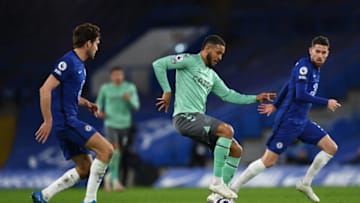 LONDON, ENGLAND - MARCH 08: Joshua King of Everton is challenged by Marcos Alonso of Chelsea during the Premier League match between Chelsea and Everton at Stamford Bridge on March 08, 2021 in London, England. Sporting stadiums around the UK remain under strict restrictions due to the Coronavirus Pandemic as Government social distancing laws prohibit fans inside venues resulting in games being played behind closed doors. (Photo by Glyn Kirk - Pool/Getty Images)