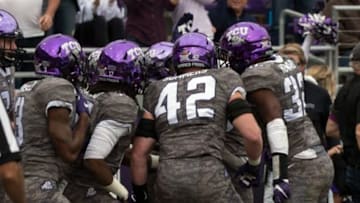 Nov 14, 2015; Fort Worth, TX, USA; The TCU Horned Frogs celebrate during the first quarter against the Kansas Jayhawks at Amon G. Carter Stadium. Mandatory Credit: Jerome Miron-USA TODAY Sports