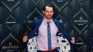 LAS VEGAS, NV - JUNE 19: Mark Stone of the Vegas Golden Knights shows off the VGK lining of his suit jacket as he poses for photos on the red carpet during the 2019 NHL Awards at Mandalay Bay Resort and Casino on June 19, 2019 in Las Vegas, Nevada. (Photo by Jeff Speer/Icon Sportswire via Getty Images)