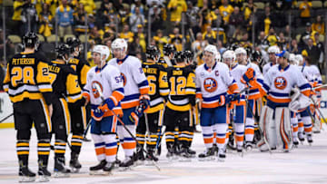 PITTSBURGH, PA - APRIL 16: The New York Islanders and Pittsburgh Penguins shake hands at the end Game 4 in the First Round of the 2019 NHL Stanley Cup Playoffs between the New York Islanders and the Pittsburgh Penguins on April 16, 2019, at PPG Paints Arena in Pittsburgh, PA. The New York Islanders won the series 4-0. (Photo by Jeanine Leech/Icon Sportswire via Getty Images)