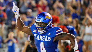 Sep 1, 2023; Lawrence, Kansas, USA; Kansas Jayhawks running back Devin Neal (4) celebrates after scoring a touchdown during the second half against the Missouri State Bears at David Booth Kansas Memorial Stadium. Mandatory Credit: Jay Biggerstaff-USA TODAY Sports