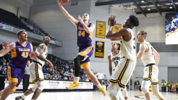 CATSONSVILLE, MD - FEBRUARY 18: Joe Cremo #24 of the Albany Great Danes drives to the basket during a college basketball game against the UMBC Retrievers at the Events Center on February 18, 2018 in Catonsville, Maryland. The Retrievers won 68-60. (Photo by Mitchell Layton/Getty Images)