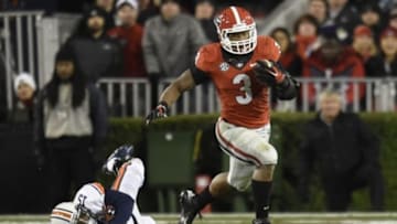 Nov 15, 2014; Athens, GA, USA; Georgia Bulldogs running back Todd Gurley (3) breaks a tackle by Auburn Tigers defensive back Joshua Holsey (15) during the second half at Sanford Stadium. Georgia defeated Auburn 34-7. Mandatory Credit: Dale Zanine-USA TODAY Sports