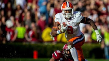 Nov 28, 2015; Columbia, SC, USA; Clemson Tigers running back Wayne Gallman (9) makes a big gain past South Carolina Gamecocks safety T.J. Gurley (20) in the second half of the game at Williams-Brice Stadium. Mandatory Credit: Jeff Blake-USA TODAY Sports