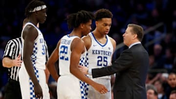 NEW YORK, NY - DECEMBER 09: Head coach John Calipari of the Kentucky Wildcats talks with PJ Washington