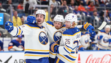 Oct 14, 2023; Elmont, New York, USA; Buffalo Sabres center Casey Mittelstadt (37) celebrates with defensemen Mattias Samuelsson (23) and Rasmus Dahlin (26) after scoring a goal in the third period at UBS Arena. Mandatory Credit: Wendell Cruz-USA TODAY Sports