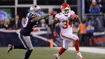 Jan 16, 2016; Foxborough, MA, USA; Kansas City Chiefs running back Knile Davis (34) runs the ball against New England Patriots free safety Devin McCourty (32) during the third quarter in the AFC Divisional round playoff game at Gillette Stadium. Mandatory Credit: Robert Deutsch-USA TODAY Sports