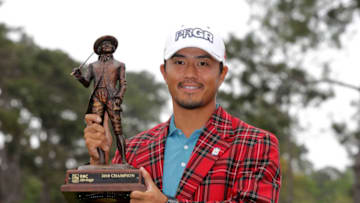 HILTON HEAD ISLAND, SC - APRIL 15: Satoshi Kodaira of Japan poses with the trophy after winning on the third playoff hole during the final round of the 2018 RBC Heritage at Harbour Town Golf Links on April 15, 2018 in Hilton Head Island, South Carolina. (Photo by Streeter Lecka/Getty Images)