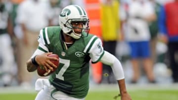 Dec 29, 2013; Miami Gardens, FL, USA; New York Jets quarterback Geno Smith (7) scrambles during the first half against the Miami Dolphins at Sun Life Stadium. Mandatory Credit: Steve Mitchell-USA TODAY Sports