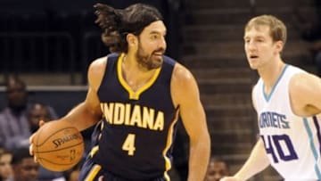 Oct 23, 2014; Charlotte, NC, USA; Indiana Pacers forward Luis Scola (4) drives past Charlotte Hornets forward Cody Zeller (40) during the first half of the game at Time Warner Cable Arena. Mandatory Credit: Sam Sharpe-USA TODAY Sports