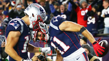 FOXBOROUGH, MA - OCTOBER 14: Julian Edelman #11 reacts with Chris Hogan #15 of the New England Patriots after scoring a rtouchdown in the second quarter of a game against the Kansas City Chiefs at Gillette Stadium on October 14, 2018 in Foxborough, Massachusetts. (Photo by Adam Glanzman/Getty Images)
