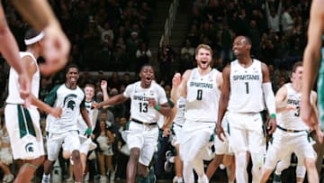 EAST LANSING, MI - DECEMBER 16: Gabe Brown #13 of the Michigan State Spartans celebrates Xavier Tilman #23 of the Michigan State Spartans made basket at the end of the first half against Green Bay Phoenix at Breslin Center on December 16, 2018 in East Lansing, Michigan. (Photo by Rey Del Rio/Getty Images)