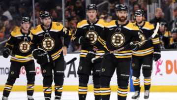 BOSTON, MASSACHUSETTS - OCTOBER 17: Nick Foligno #17, Charlie Coyle #13 and Jake DeBrusk #74 of the Boston Bruins look on during the first period against the Florida Panthers at TD Garden on October 17, 2022 in Boston, Massachusetts. (Photo by Maddie Meyer/Getty Images)