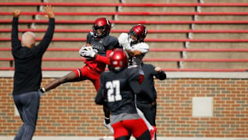 Cincinnati Bearcats defensive back JD Hardaway intercepts a pass during spring practice at Nippert Stadium. The Enquirer.