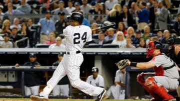 Sep 5, 2013; Bronx, NY, USA; New York Yankees second baseman Robinson Cano (24) doubles to deep right allowing two runners to score during the third inning against the Boston Red Sox at Yankee Stadium. Mandatory Credit: Anthony Gruppuso-USA TODAY Sports