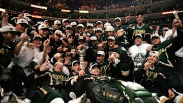 19 Jun 1999: The Dallas Stars pose for a team photo with the Stanely Cup trophy as they celebrate the win over the Buffalo Sabres at the Marine Midland Arena in Buffalo, New York. The Dallas Stars defeated the Sabres 2-1 in the third overtime. Mandatory Credit: Elsa Hasch /Allsport