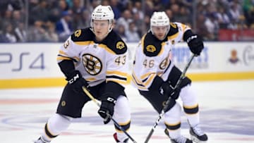 Oct 15, 2016; Toronto, Ontario, CAN; Boston Bruins forward Danton Heinen (43) carries the puck up ice as forward David Krejci (46) trails the play during a 4-1 loss to Toronto Maple Leafs at Air Canada Centre. Mandatory Credit: Dan Hamilton-USA TODAY Sports