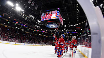 Apr 24, 2022; Montreal, Quebec, CAN; The Montreal Canadiens players raise their sticks toward the banner honoring the retired jersey number of Guy Lafleur after the game against the Boston Bruins at the Bell Centre. Mandatory Credit: Eric Bolte-USA TODAY Sports