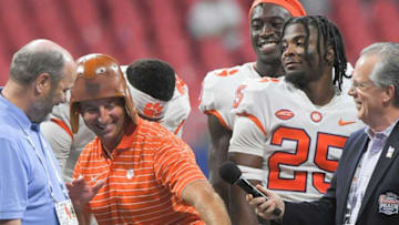 Clemson head coach Dabo Swinney poses with a leather Chick- Fil-A Classic helmet after the game at the Mercedes-Benz Stadium in Atlanta, Georgia Monday, September 5, 2022.Ncaa Fb Clemson At Georgia Tech