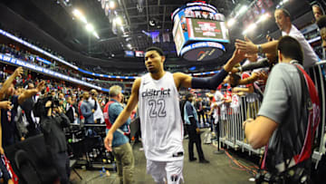 WASHINGTON, DC -  APRIL 22: Otto Porter Jr. #22 of the Washington Wizards exchanges high fives with fans as he exits the arena after Game Four of Round One of the 2018 NBA Playoffs against the Toronto Raptors on April 22, 2018 at Capital One Arena in Washington, DC. NOTE TO USER: User expressly acknowledges and agrees that, by downloading and or using this Photograph, user is consenting to the terms and conditions of the Getty Images License Agreement. Mandatory Copyright Notice: Copyright 2018 NBAE (Photo by Jesse D. Garrabrant/NBAE via Getty Images)