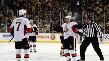 April 28, 2013; Boston, MA USA; Ottawa Senators right wing Daniel Alfredsson (11) reacts after an empty net goal by center Kyle Turris (7) during the third period against the Boston Bruins at TD Garden. Mandatory Credit: Bob DeChiara-USA TODAY Sports