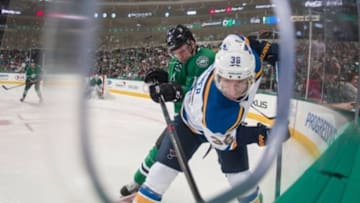 Mar 12, 2016; Dallas, TX, USA; St. Louis Blues right wing Troy Brouwer (36) and Dallas Stars center Radek Faksa (12) fight for the puck during the second period at the American Airlines Center. Mandatory Credit: Jerome Miron-USA TODAY Sports