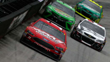 BRISTOL, TN - APRIL 24: Clint Bowyer, driver of the #14 Haas Automation Demo Days Ford, leads a pack of cars during the Monster Energy NASCAR Cup Series Food City 500 at Bristol Motor Speedway on April 24, 2017 in Bristol, Tennessee. (Photo by Sean Gardner/Getty Images)