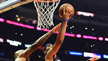 LOS ANGELES, CA - NOVEMBER 16: Vince Carter #15 of the Memphis Grizzlies scores on a layup in front of Marreese Speights #5 of the LA Clippers during the first half at Staples Center on November 16, 2016 in Los Angeles, California. NOTE TO USER: User expressly acknowledges and agrees that, by downloading and or using this photograph, User is consenting to the terms and conditions of the Getty Images License Agreement. (Photo by Harry How/Getty Images)
