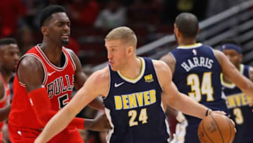 CHICAGO, IL - MARCH 21: Mason Plumlee #24 of the Denver Nuggets moves against Bobby Portis #5 of the Chicago Bulls at the United Center on March 21, 2018 in Chicago, Illinois. The Nuggets defeated the Bulls 135-102. NOTE TO USER: User expressly acknowledges and agrees that, by downloading and or using this photograph, User is consenting to the terms and conditions of the Getty Images License Agreement. (Photo by Jonathan Daniel/Getty Images)