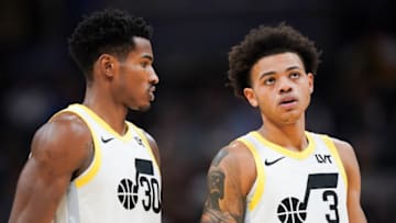 INDIANAPOLIS, INDIANA - NOVEMBER 08: Ochai Agbaji #30 and Keyonte George #3 of the Utah Jazz meet in the third quarter against the Indiana Pacers at Gainbridge Fieldhouse on November 08, 2023 in Indianapolis, Indiana. NOTE TO USER: User expressly acknowledges and agrees that, by downloading and or using this photograph, User is consenting to the terms and conditions of the Getty Images License Agreement. (Photo by Dylan Buell/Getty Images)