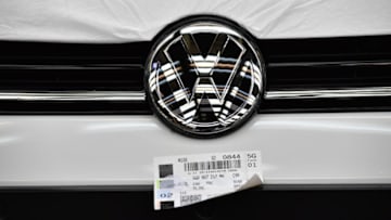 WOLFSBURG, GERMANY - MARCH 08: The Volkswagen logo is displayed under a cover on a Volkswagen Golf car at the Volkswagen factory on March 8, 2018 in Wolfsburg, Germany. U.S. President Donald Trump has threatened to impose tariffs on imports of cars made in Europe in an ongoing and escalating riff with the European Commission following Trump's original announcement that he will impose tariffs on imported steel and aluminum, to which the European Commission countered with potential tariffs on U.S. motorcycles, bourbon and jeans. Volkswagen is due to announce financial results for 2017 next week. (Photo by Alexander Koerner/Getty Images)