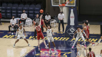 Feb 13, 2021; Morgantown, West Virginia, USA; Oklahoma Sooners guard Austin Reaves (12) shoots in the lane late in the second overtime against the West Virginia Mountaineers at WVU Coliseum. Mandatory Credit: Ben Queen-USA TODAY Sports