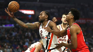 LOS ANGELES, CALIFORNIA - NOVEMBER 07: Kawhi Leonard #2 of the Los Angeles Clippers rebounds against Hassan Whiteside #21 of the Portland Trail Blazers during the first half of a game at Staples Center on November 07, 2019 in Los Angeles, California. NOTE TO USER: User expressly acknowledges and agrees that, by downloading and/or using this photograph, user is consenting to the terms and conditions of the Getty Images License Agreement (Photo by Sean M. Haffey/Getty Images)