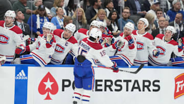 Oct 11, 2023; Toronto, Ontario, CAN; Montreal Canadiens center Alex Newhook (15) celebrates at the bench after scoring a goal against the Toronto Maple Leafs during the second period at Scotiabank Arena. Mandatory Credit: Nick Turchiaro-USA TODAY Sports