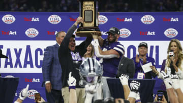 Kansas State Wildcats head coach Chris Klieman and quarterback Skylar Thompson (7) hold up the 2022 Texas Bowl championship trophy Mandatory Credit: Troy Taormina-USA TODAY Sports