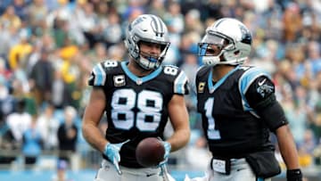 CHARLOTTE, NC - DECEMBER 17: Greg Olsen #88 celebrates with teammate Cam Newton #1 of the Carolina Panthers after a touchdown against the Green Bay Packers in the third quarter during their game at Bank of America Stadium on December 17, 2017 in Charlotte, North Carolina. (Photo by Streeter Lecka/Getty Images)