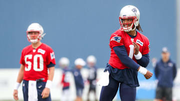 Auburn footballJul 28, 2021; Foxborough, MA, United States; New England Patriots quarterback Mac Jones (50) watches New England Patriots quarterback Cam Newton (1) during training camp at Gillette Stadium. Mandatory Credit: Paul Rutherford-USA TODAY Sports