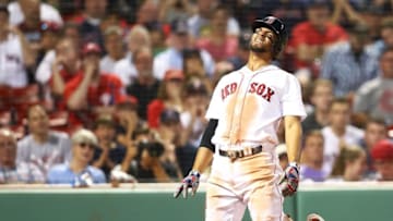 BOSTON, MA - JULY 31: Xander Bogaerts #2 of the Boston Red Sox reacts after being hit by a pitch in the ninth inning of a game against the Philadelphia Phillies at Fenway Park on July 31, 2018 in Boston, Massachusetts. (Photo by Adam Glanzman/Getty Images)