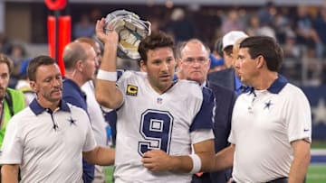 Nov 26, 2015; Arlington, TX, USA; Dallas Cowboys quarterback Tony Romo (9) leaves the field with a season ending injury he suffered during the game against the Carolina Panthers on Thanksgiving at AT&T Stadium. The Panthers defeat the Cowboys 33-14. Mandatory Credit: Jerome Miron-USA TODAY Sports