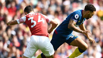 LONDON, ENGLAND - AUGUST 25: Granit Xhaka of Arsenal and Ryan Fredericks of West Ham United clash during the Premier League match between Arsenal FC and West Ham United at Emirates Stadium on August 25, 2018 in London, United Kingdom. (Photo by Clive Mason/Getty Images)